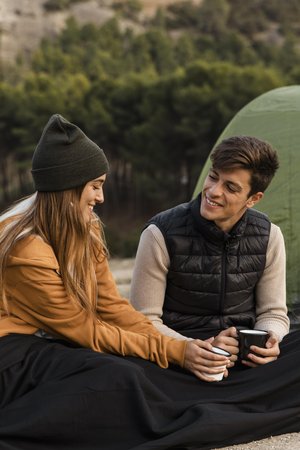 Couple talking together while camping