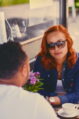 Couple sharing coffee at a cafe