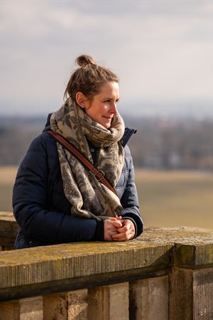 Woman standing outdoors and looking into the distance