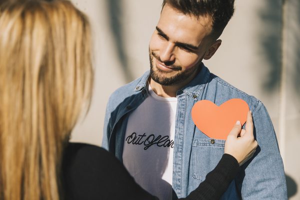 Couple sharing a heart during a date